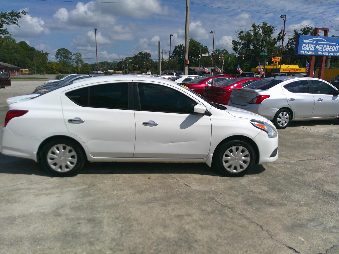 2016 WHITE NISSAN VERSA S; SL; SV (3N1CN7AP4GL) , located at 1200 Cassat Avenue, Jacksonville, FL, 32205, (904) 695-1885, 30.302404, -81.731033 - Photo#2